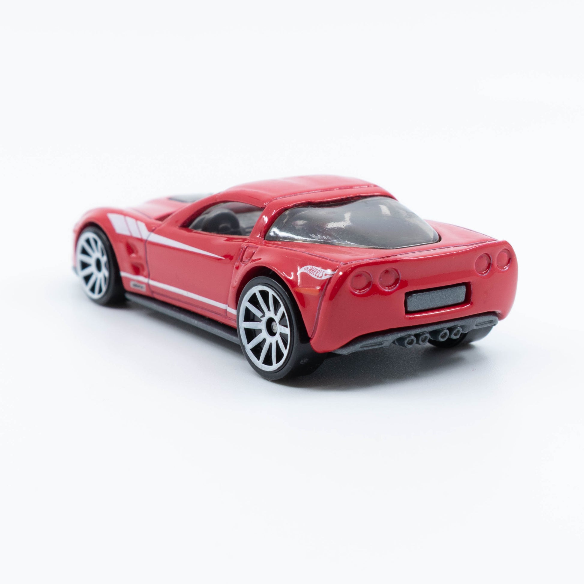 Hot Wheels diecast of the 2009 Corvette ZR1 with detailed body and clear hood showcasing engine. Back
