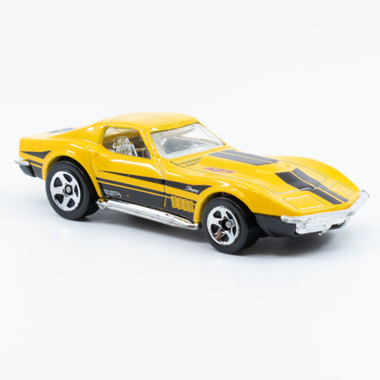 Hot Wheels 1:64 scale '69 Corvette diecast with classic muscle car design and detailed finish. Front