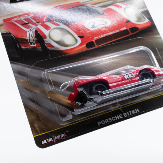 Hot Wheels Car Culture Circuit Legends Porsche 917KH diecast car model in 1:64 scale with authentic racing decals and aerodynamic design. Damaged blister
