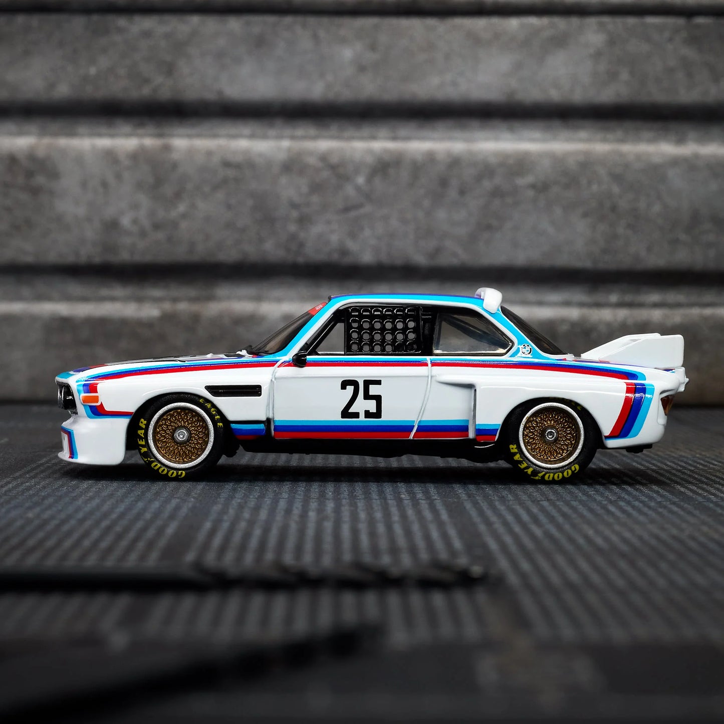 Hot Wheels Elite 64 1975 BMW 3.0 CSL Race gloss white premium die-cast model.