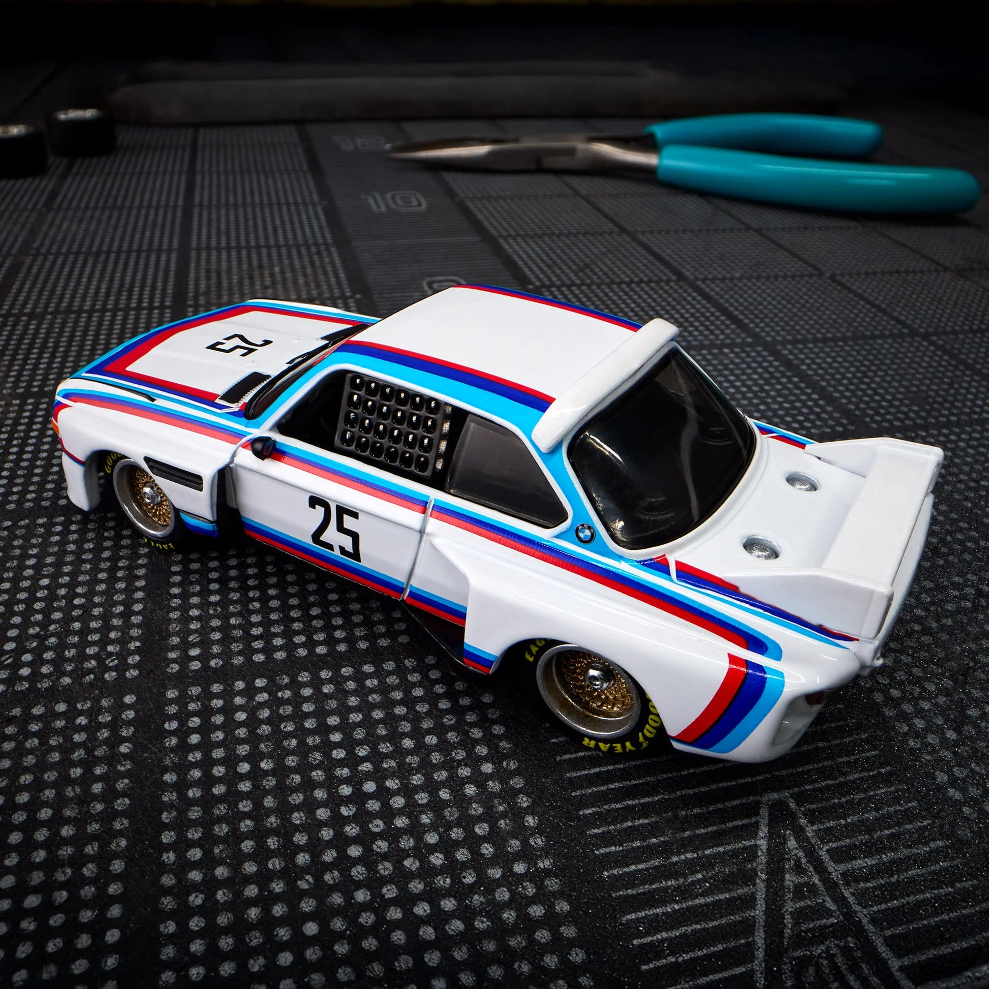 Hot Wheels Elite 64 1975 BMW 3.0 CSL Race gloss white premium die-cast model.