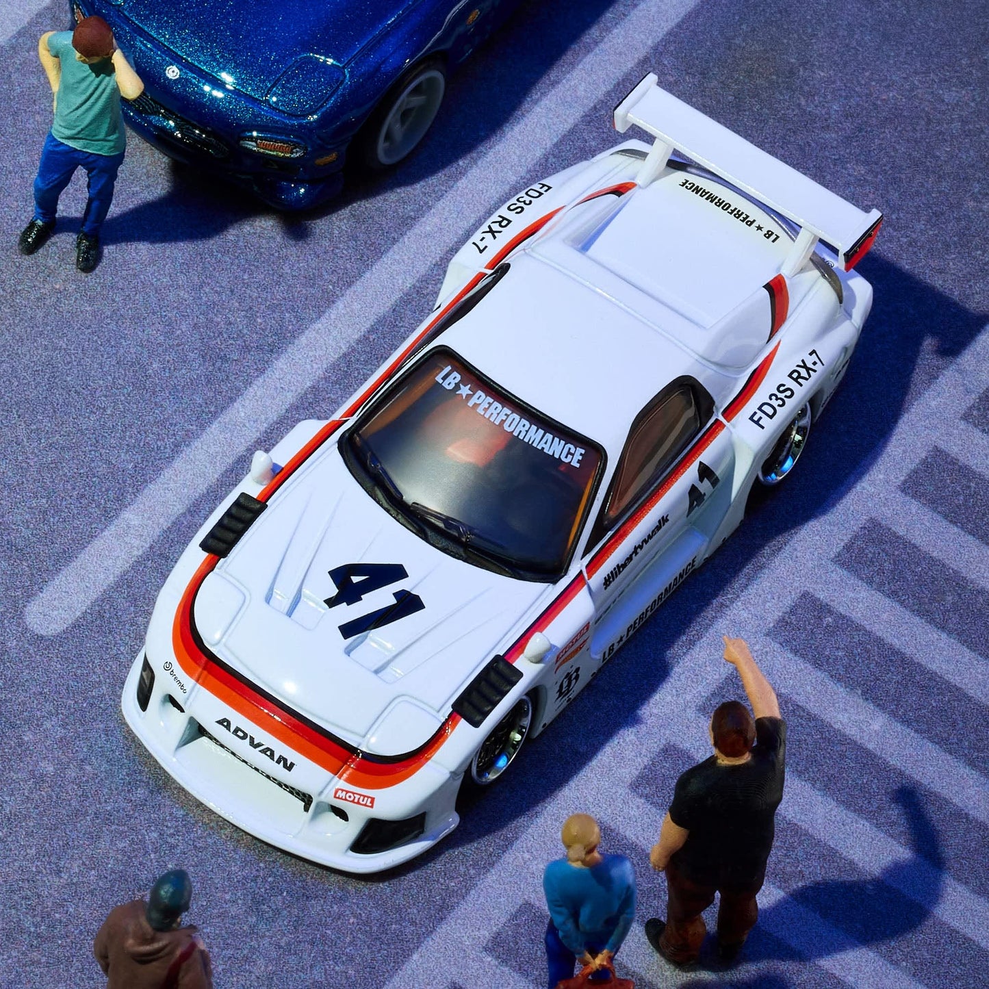 Hot Wheels Elite 64 Mazda RX-7 Liberty Walk in white LBWK race livery.