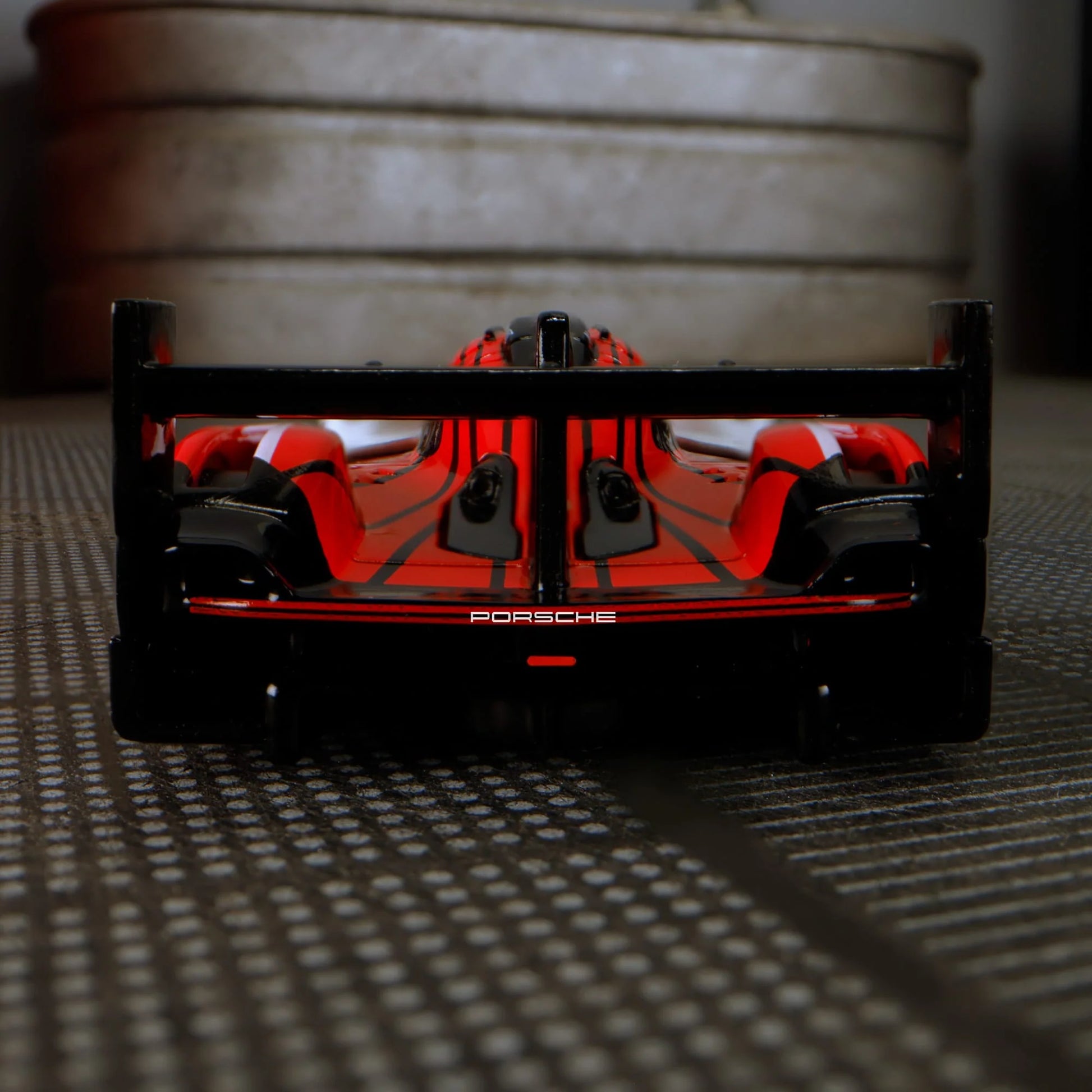 Hot Wheels Elite 64 Porsche 963 in Penske Team livery, featuring red, white, and black racing colors, detailed aero bodywork, and Real Riders wheels.