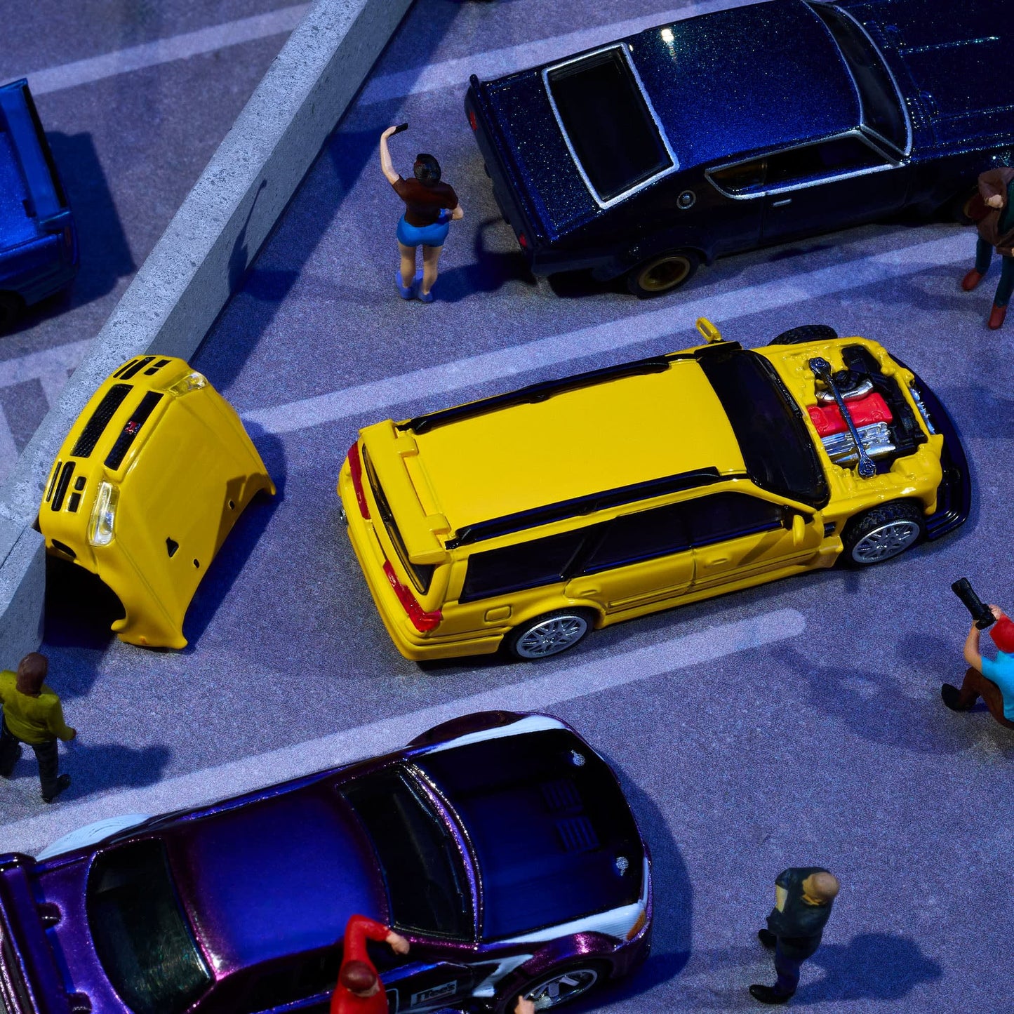 Hot Wheels Elite 64 Mod Shop Nissan Stagea in gloss yellow with interchangeable GT-R front end, opening hood, RB26 engine, and accessory kit.