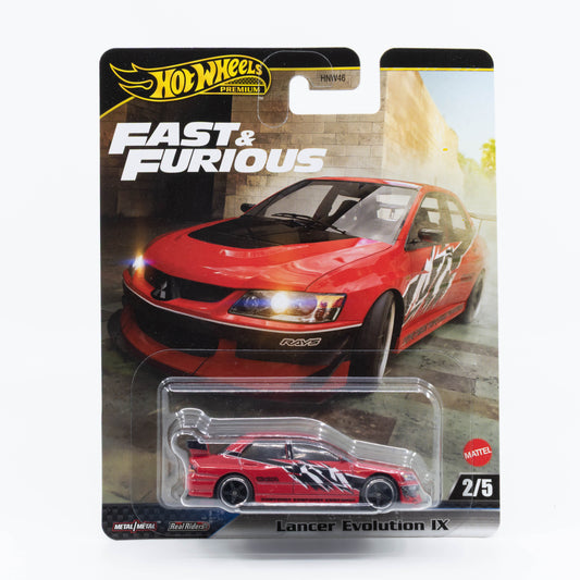 Hot Wheels 1:64 scale Lancer Evolution IX in red, modeled after the car from Fast & Furious: Tokyo Drift.