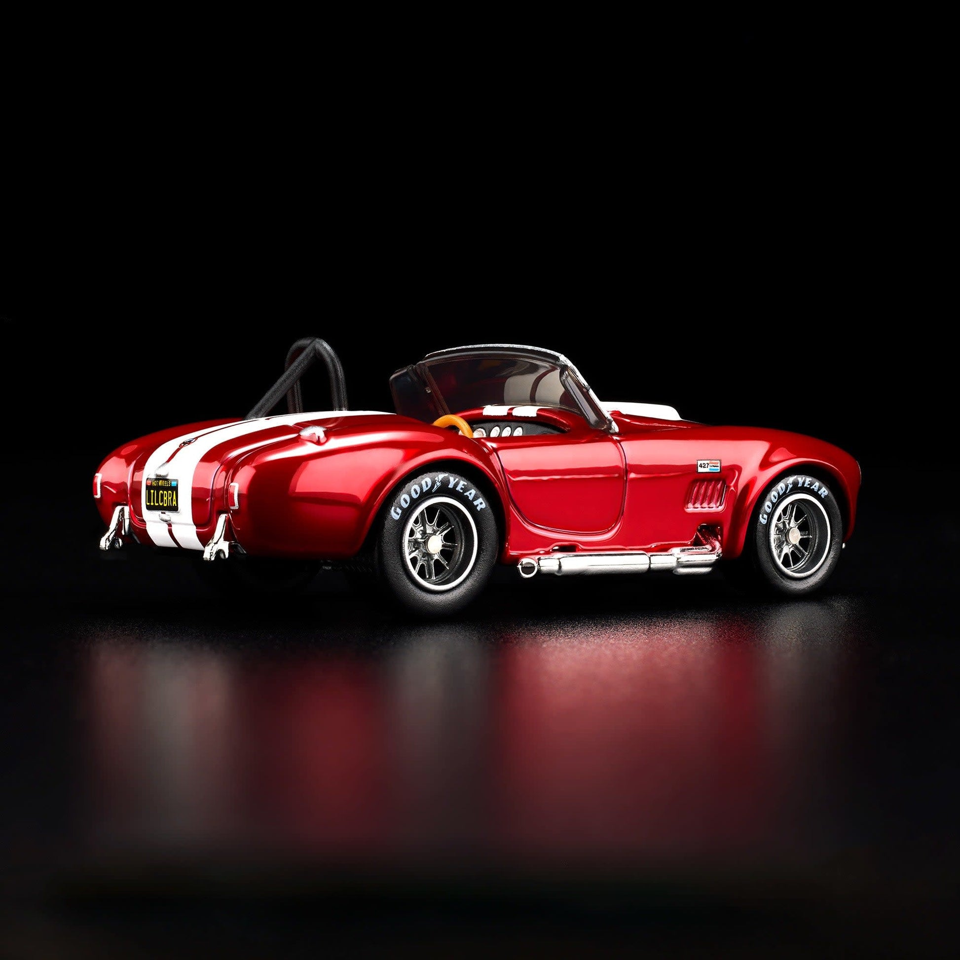 Hot Wheels RLC 2026 membership car, 1965 Shelby Cobra 427 S/C in Spectraflame bright red with opening hood and detailed V8 engine.