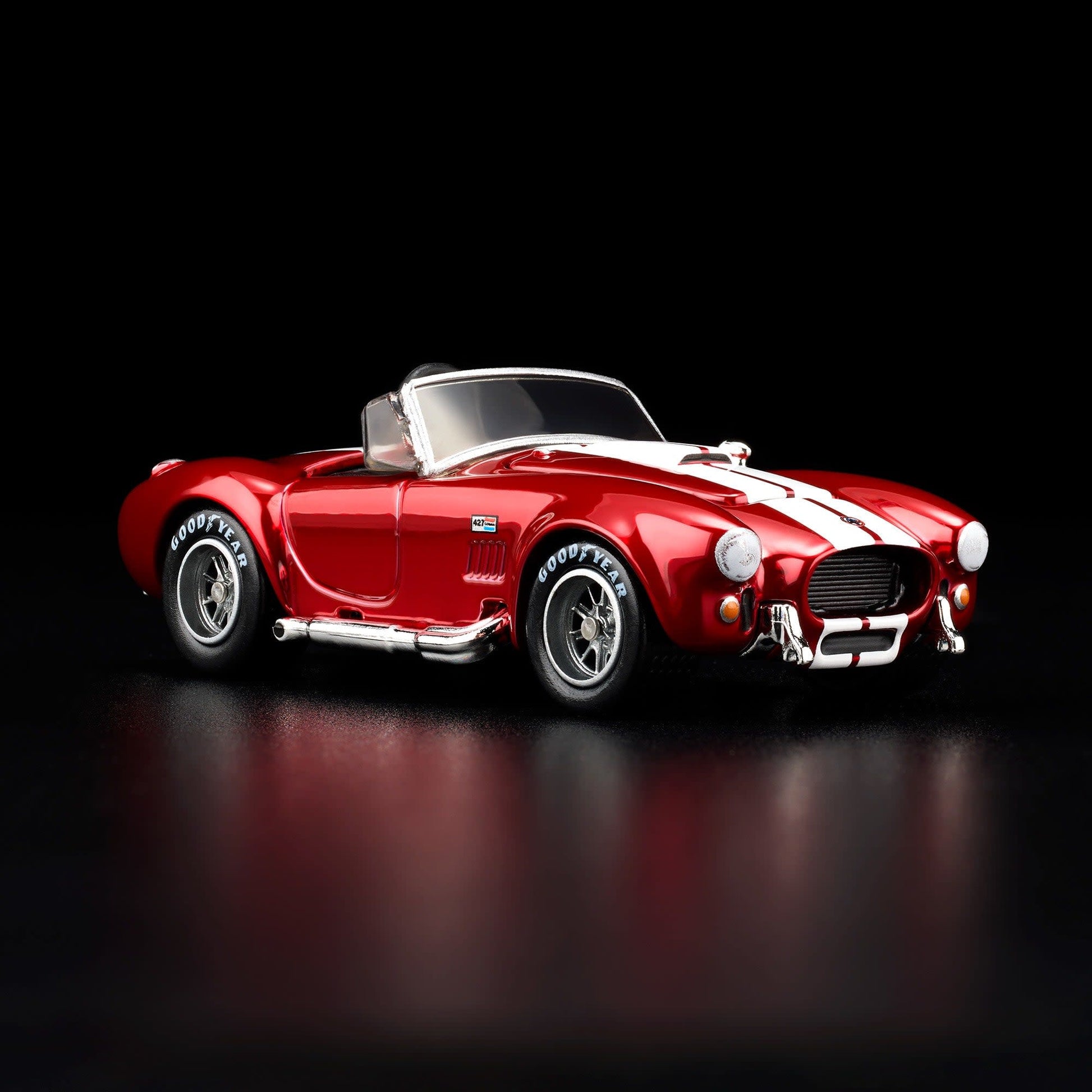 Hot Wheels RLC 2026 membership car, 1965 Shelby Cobra 427 S/C in Spectraflame bright red with opening hood and detailed V8 engine.