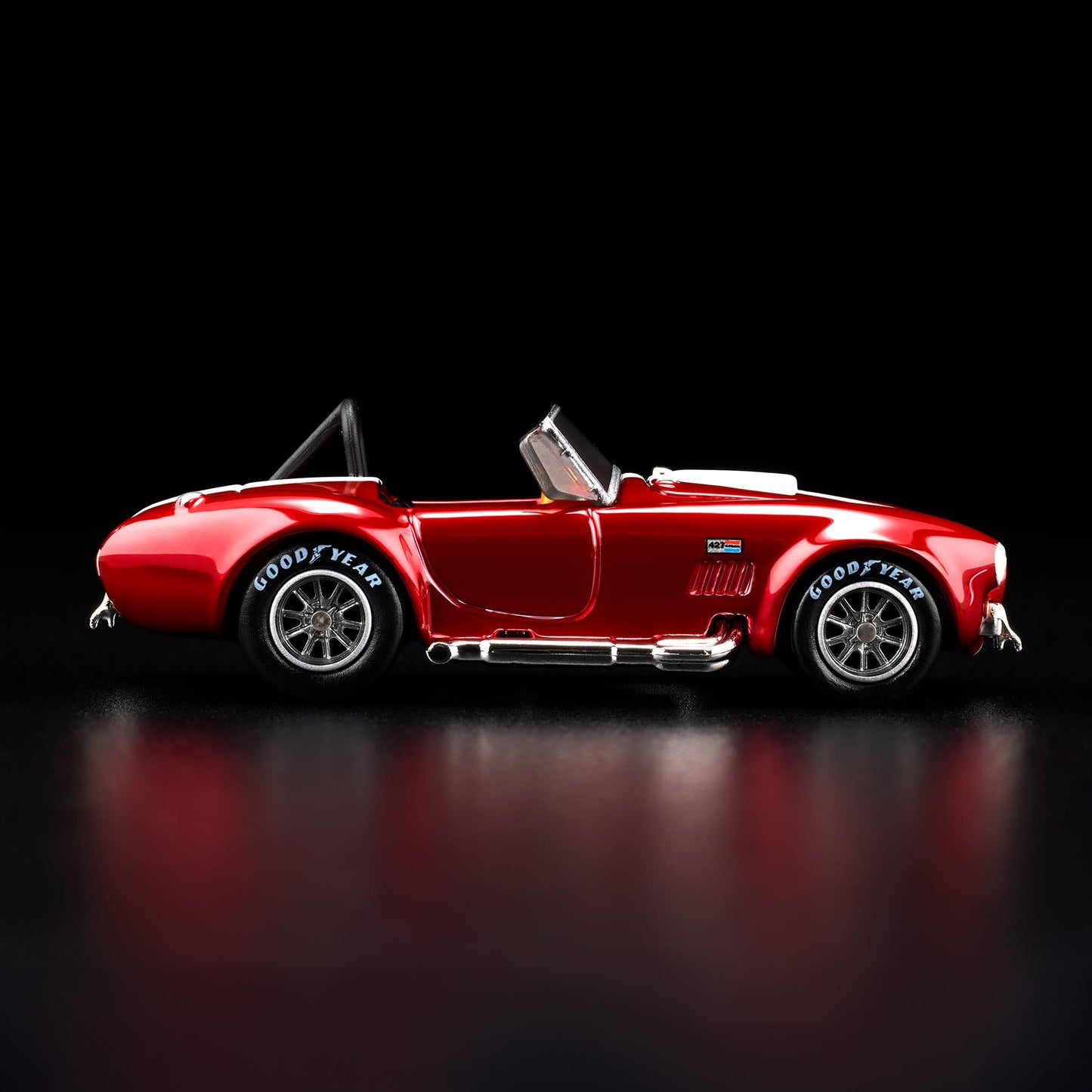 Hot Wheels RLC 2026 membership car, 1965 Shelby Cobra 427 S/C in Spectraflame bright red with opening hood and detailed V8 engine.