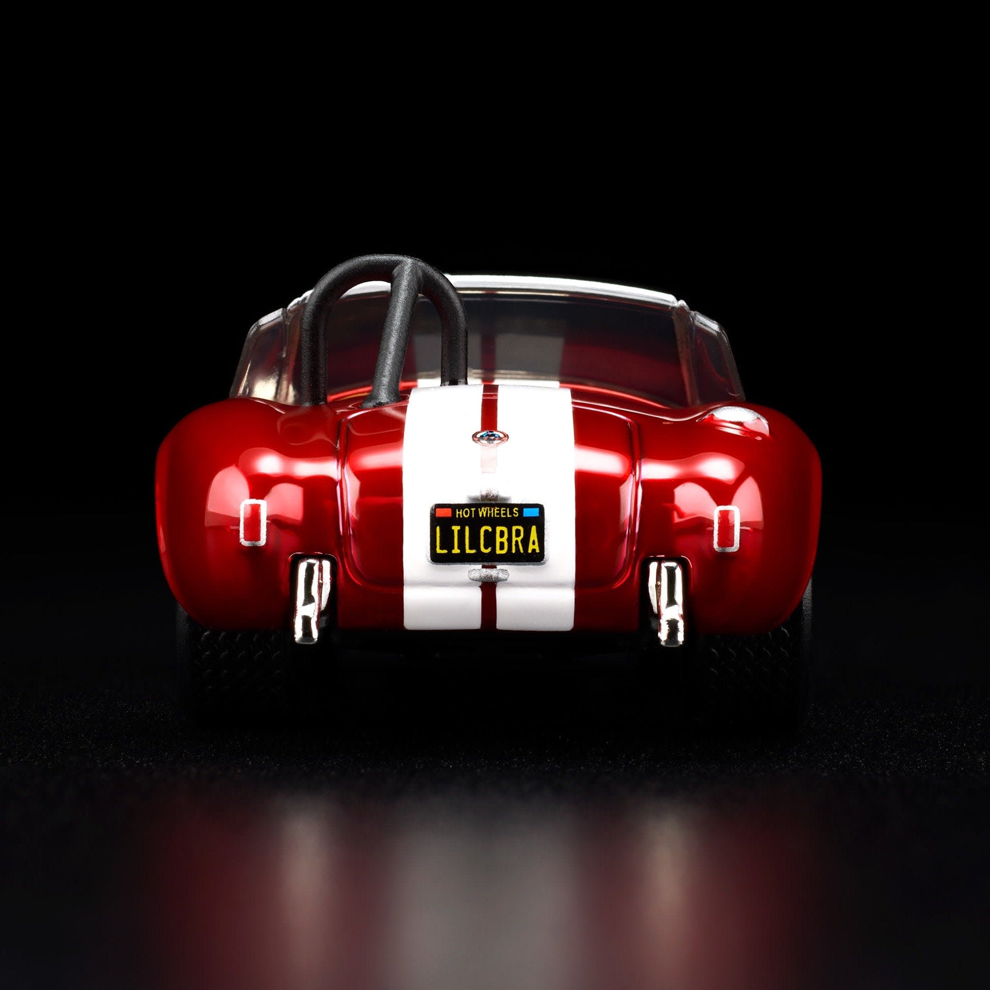 Hot Wheels RLC 2026 membership car, 1965 Shelby Cobra 427 S/C in Spectraflame bright red with opening hood and detailed V8 engine.