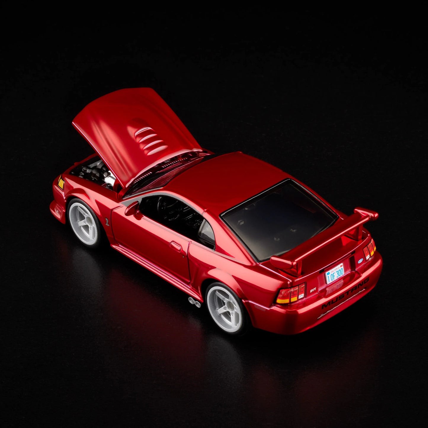 1:64 Hot Wheels RLC 2000 Ford Mustang SVT Cobra R Spectraflame bright red with opening hood.