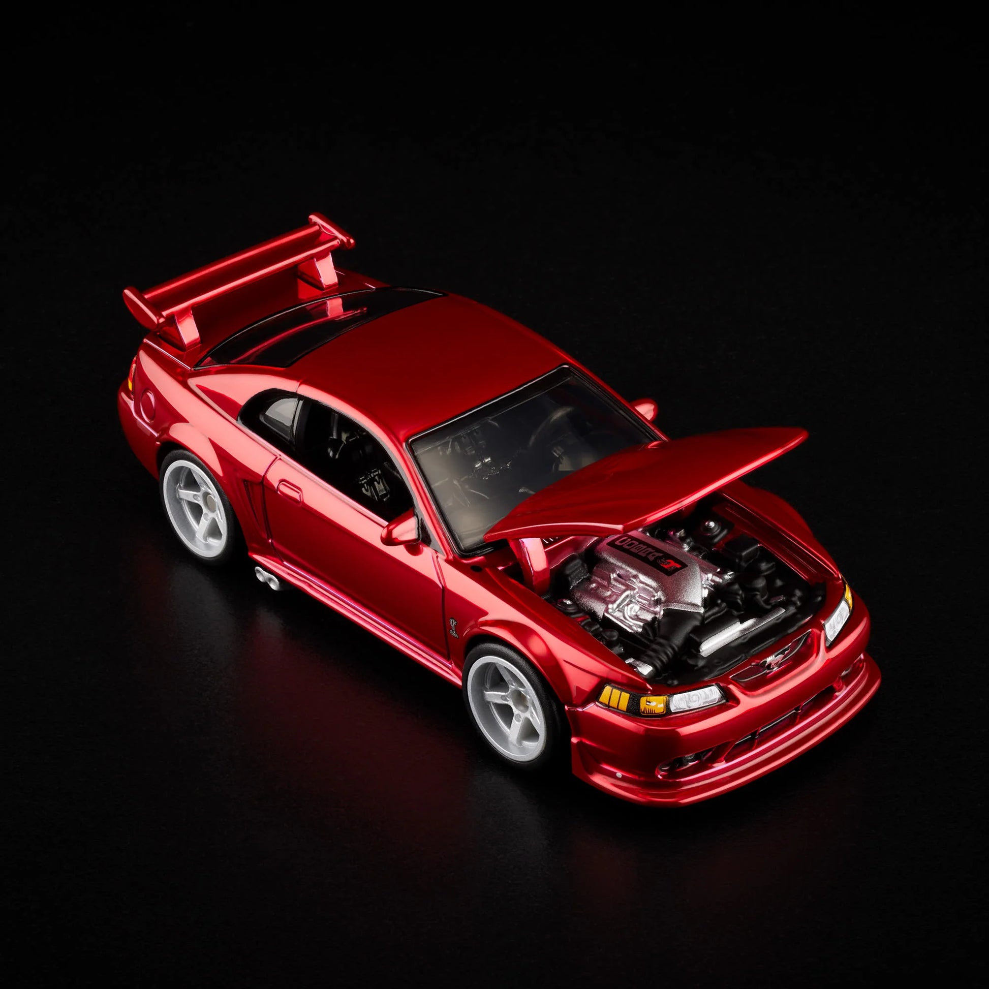 1:64 Hot Wheels RLC 2000 Ford Mustang SVT Cobra R Spectraflame bright red with opening hood.
