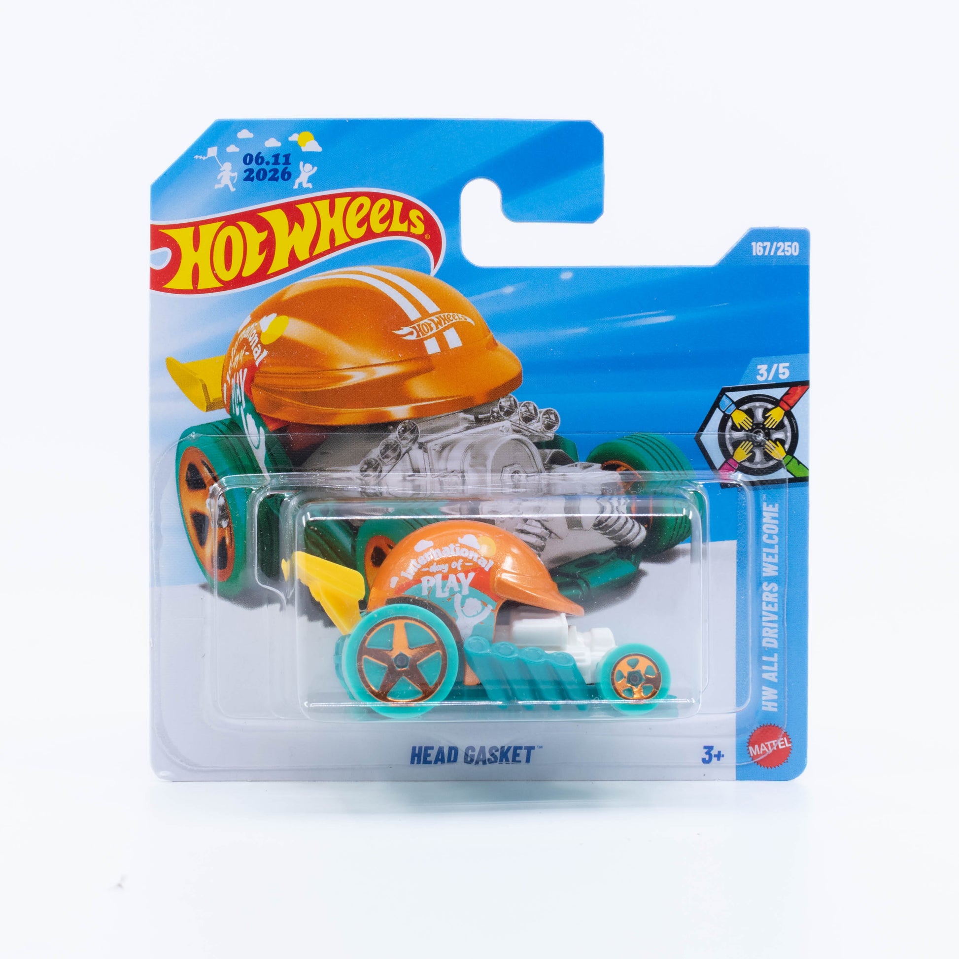 Hot Wheels Head Gasket fantasy vehicle in green and orange, inspired by a racing helmet mounted on an engine.
