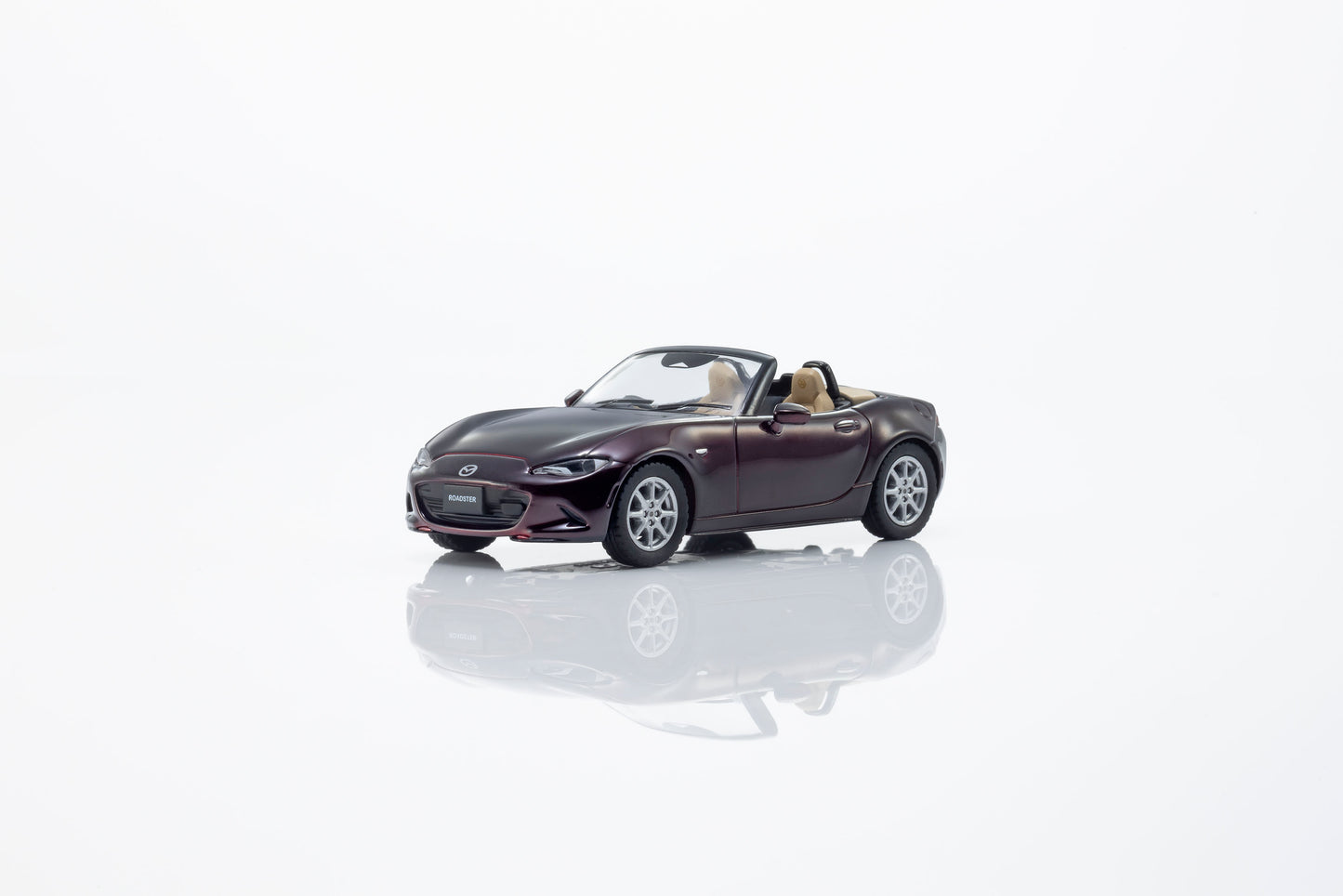 Kyosho 1:64 Mazda Roadster 35th Anniversary red convertible diecast model. Front