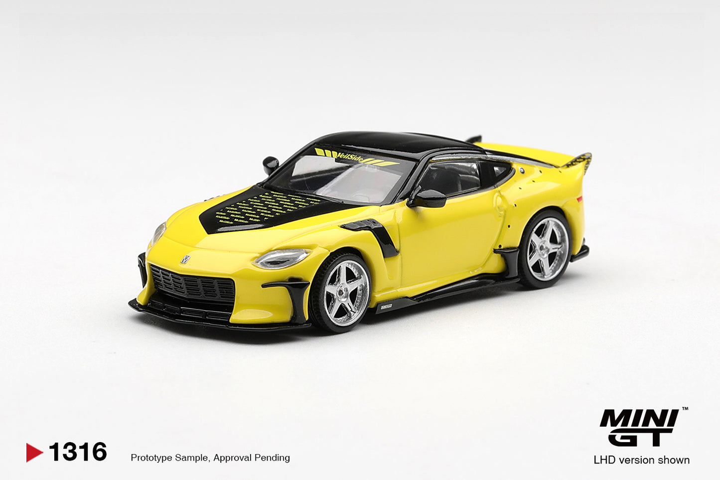 Mini GT Nissan FFZ400 VeilSide in Ikazuchi Yellow with aggressive widebody styling. Front