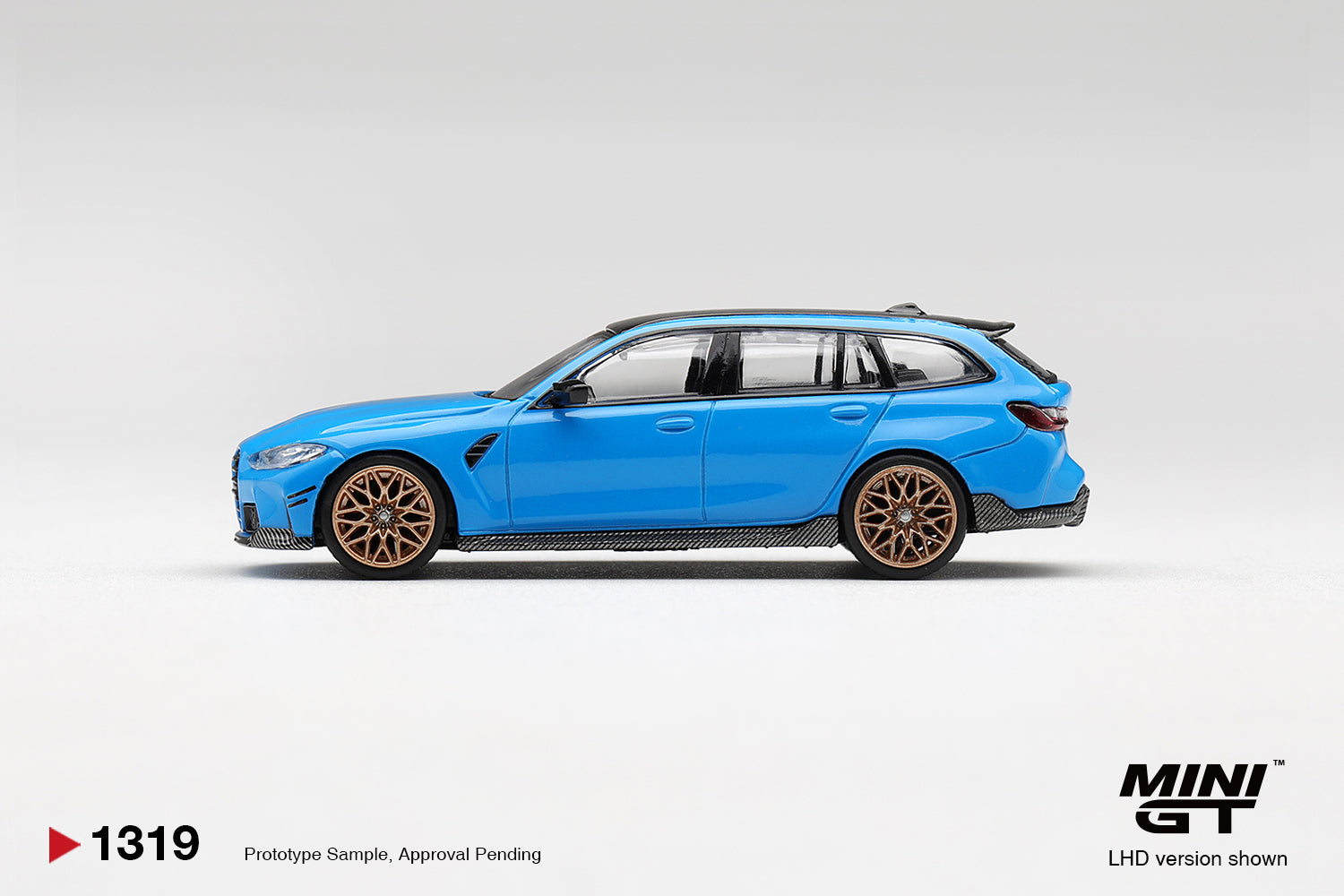 Mini GT BMW M3 M Performance Touring in Riviera Blue. Side