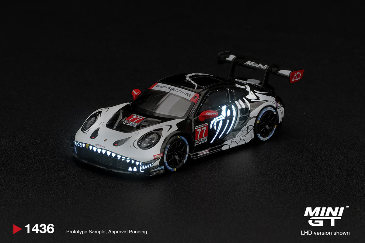 Mini GT Porsche 911 992 GT3 R number 77 AO Racing Skeleton Rexy Petit Le Mans 2026, 1:64 model