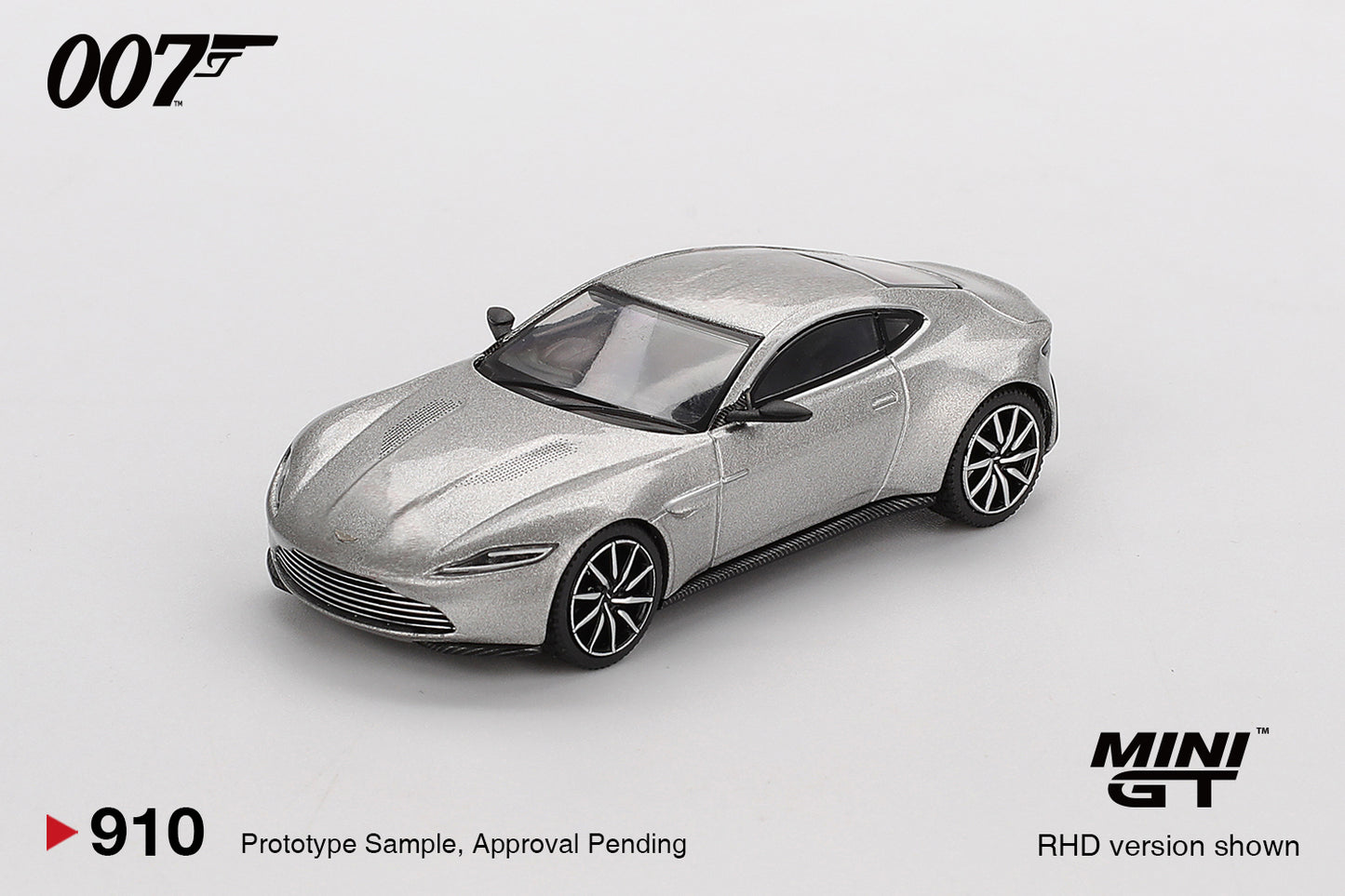 1:64 Mini GT Aston Martin DB10 Spectre 2015 – silver James Bond die-cast model in English packaging. Front