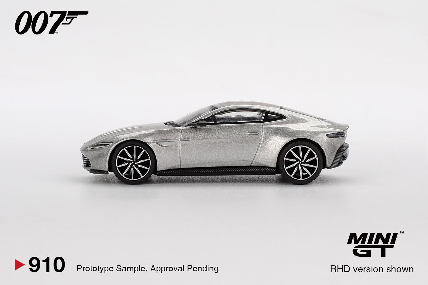 1:64 Mini GT Aston Martin DB10 Spectre 2015 – silver James Bond die-cast model in English packaging. Side