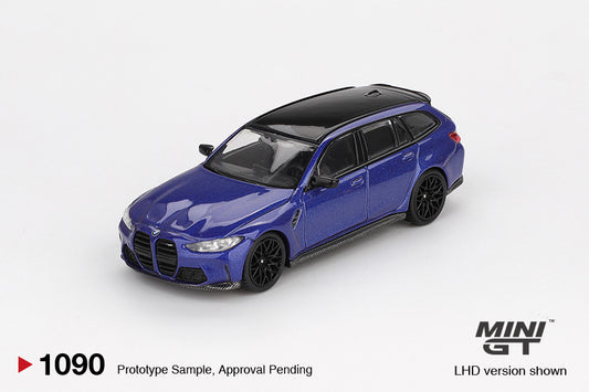 Mini GT BMW M3 Touring Competition 2023 in Portimao Blue Metallic, detailed 1:64 diecast model with black trim, M wheels, and quad exhausts. Front