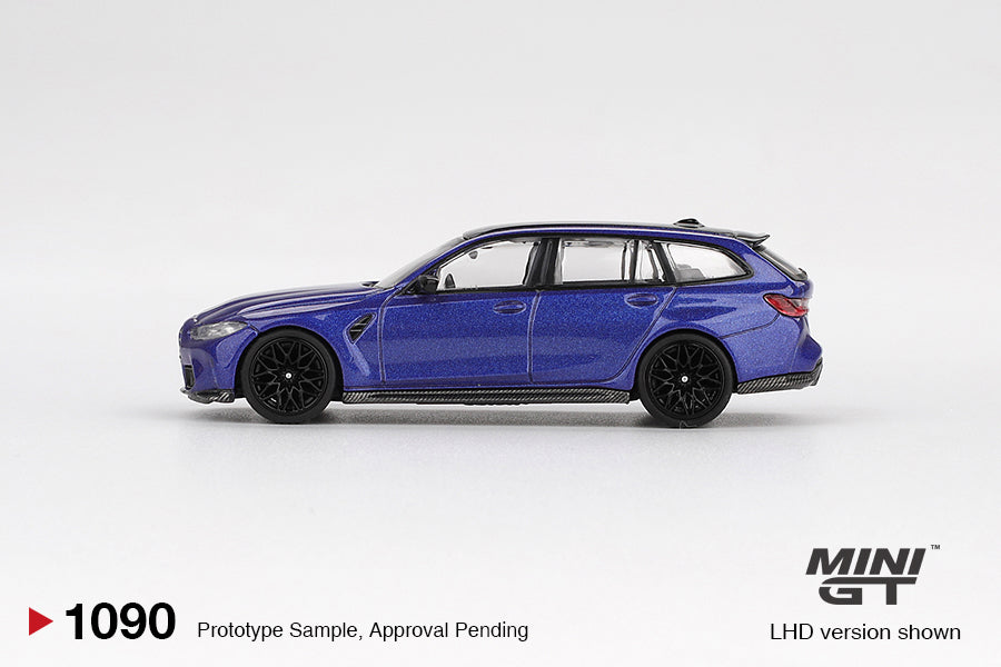 Mini GT BMW M3 Touring Competition 2023 in Portimao Blue Metallic, detailed 1:64 diecast model with black trim, M wheels, and quad exhausts. ide
