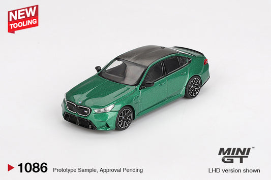 Mini GT BMW M5 G90 diecast in Isle of Man Green Metallic, 1:64 scale with detailed trim and aggressive styling. Front