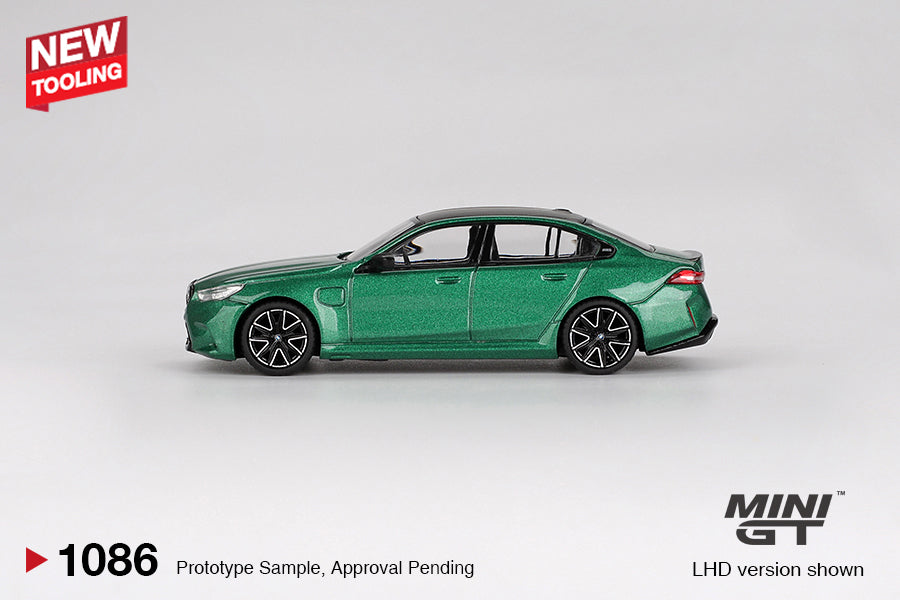 Mini GT BMW M5 G90 diecast in Isle of Man Green Metallic, 1:64 scale with detailed trim and aggressive styling. Side