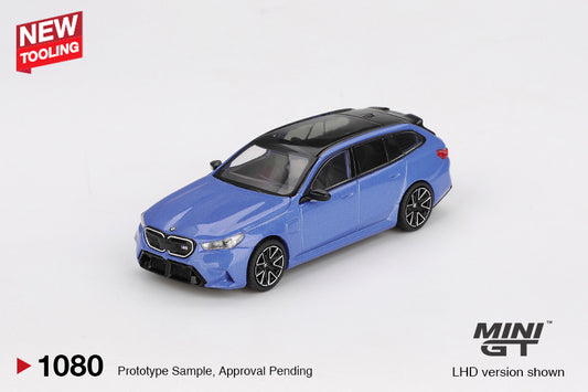 Mini GT BMW M5 (G99) Touring in metallic Marina Bay Blue, 1:64 scale diecast model. Front