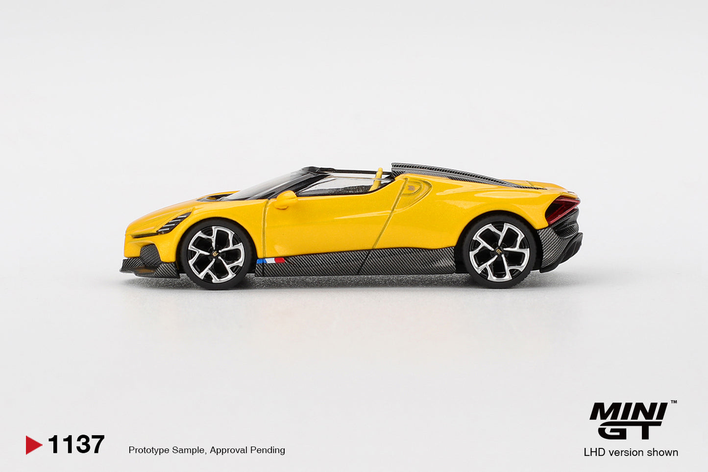 Mini GT 1:64 Bugatti W16 Mistral yellow 2023 open-top hypercar model. Side