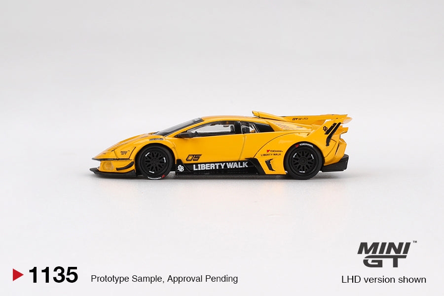 Mini GT Lamborghini Murciélago LB-Silhouette Works GT EVO in bright yellow, 1:64 diecast car with widebody kit, large rear wing, and detailed aero design. Side