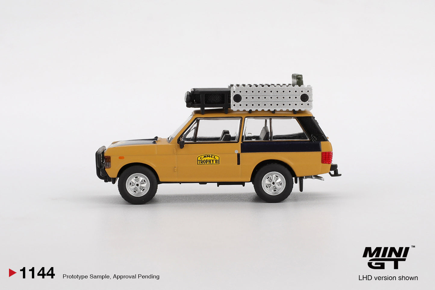 1:64 Mini GT Land Rover Range Rover Camel Trophy 1981 Winner – yellow die-cast off-road model. Side