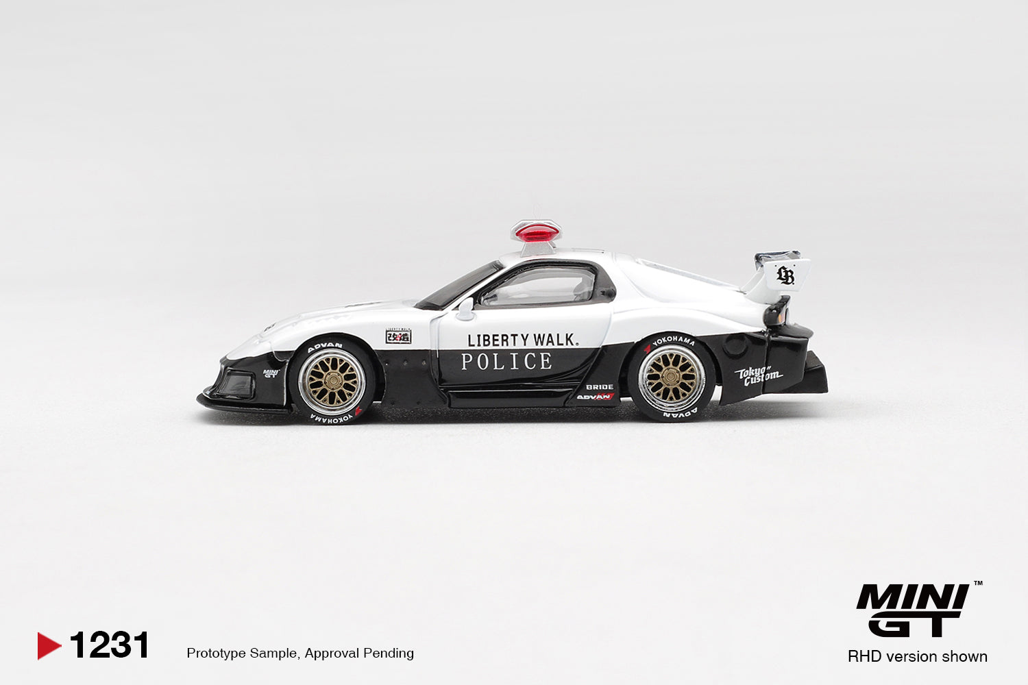 Mini GT Mazda RX7 LB Super Silhouette Police 1998 1:64 diecast model. Side