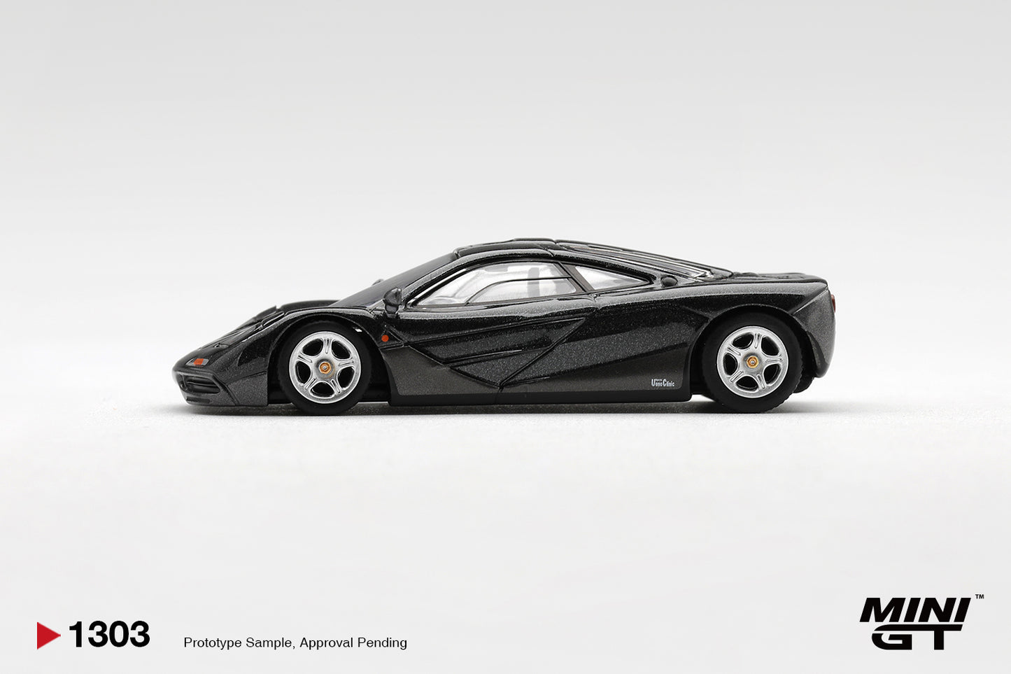 Mini GT McLaren F1 Blue Black Metallic 1993 1:64 diecast car. Side