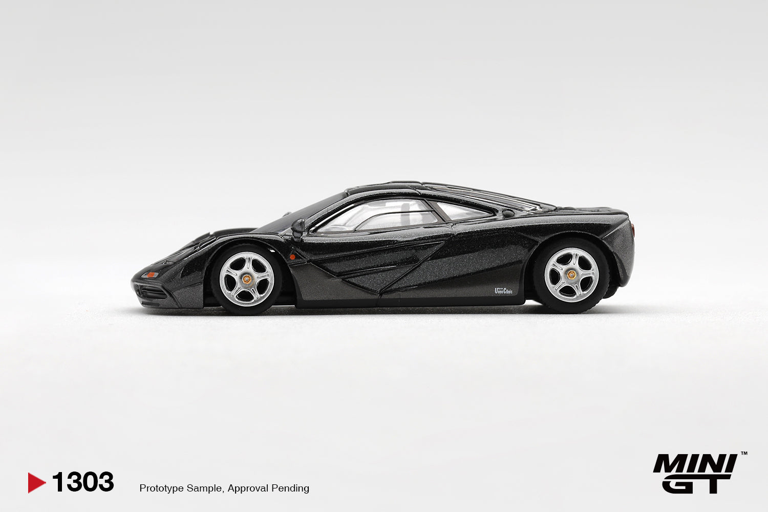 Mini GT McLaren F1 Blue Black Metallic 1993 1:64 diecast car. Side