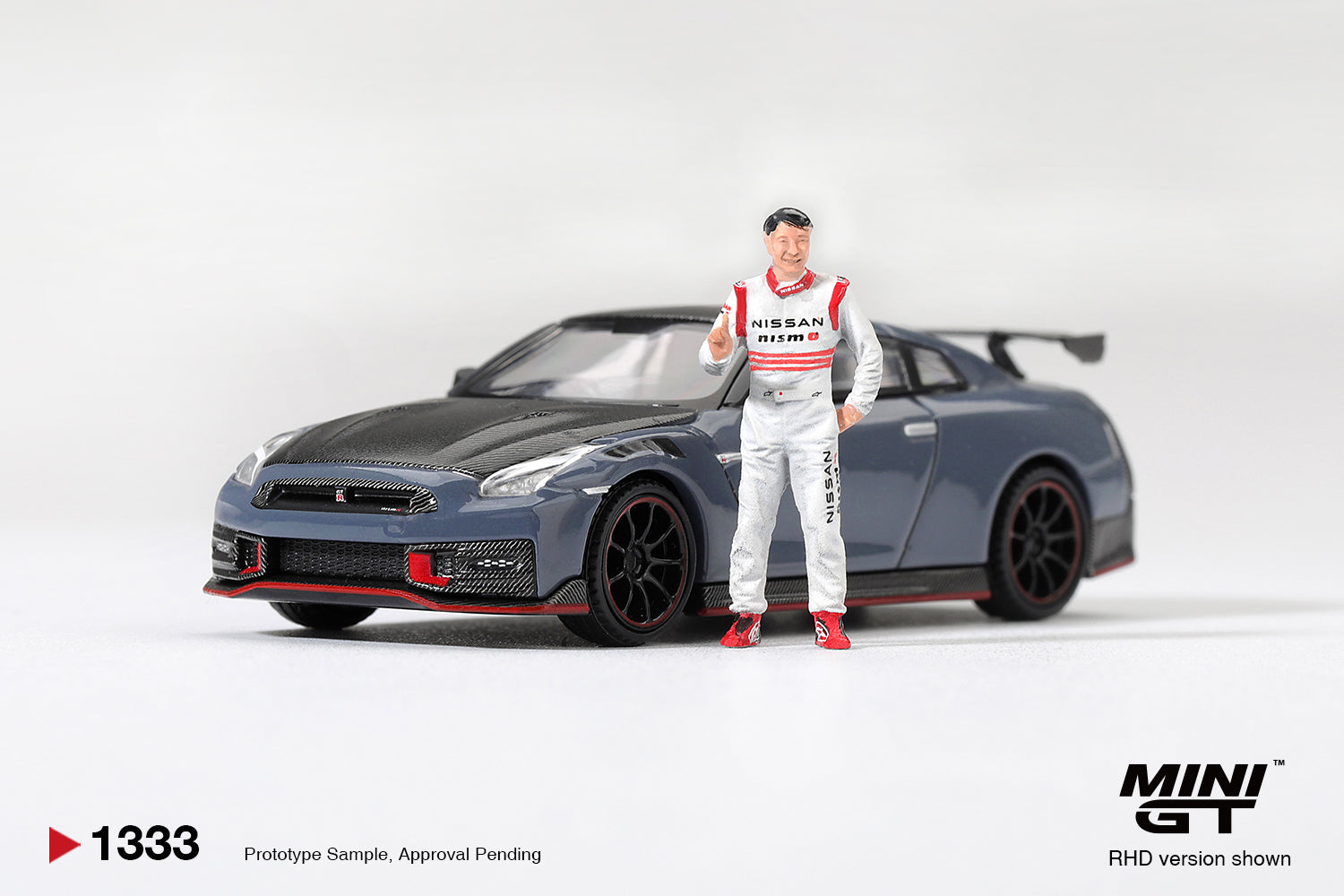 Mini GT Nissan GT-R R35 Nismo Tsukuba Lap Record with Tsugio Matsuda figure.