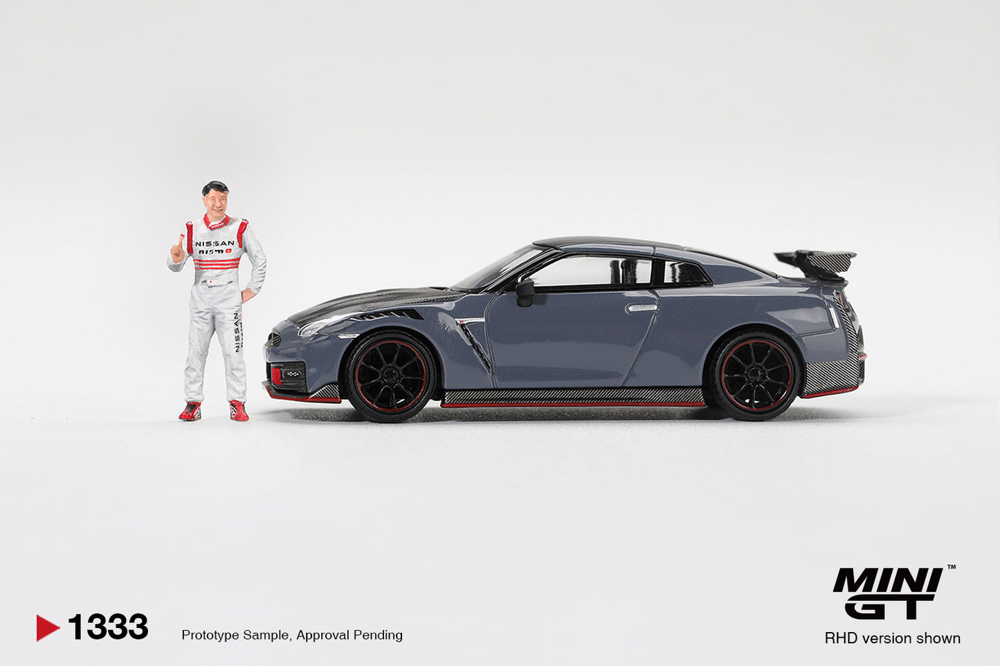Mini GT Nissan GT-R R35 Nismo Tsukuba Lap Record with Tsugio Matsuda figure.