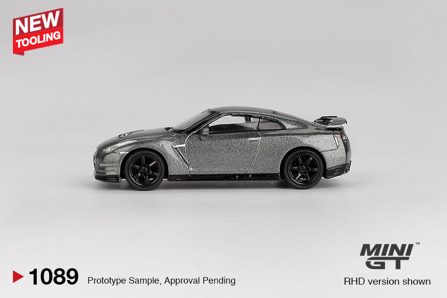 Mini GT 1:64 Nissan GT-R R35 CRS Version in Dark Metal Gray with performance detailing. Side