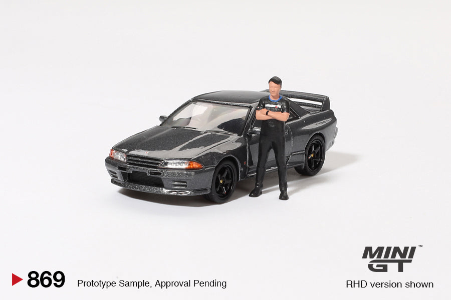 (Pre-Order) Mini GT - Nissan Skyline GT-R (R32) Nismo Nismo Gunmetal with Tsugio Matsuda Figure 1992