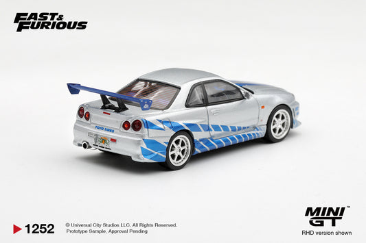 Mini GT Nissan Skyline GT-R R34 CWest from 2 Fast 2 Furious driven by Brian O'Conner, 1:64 scale.