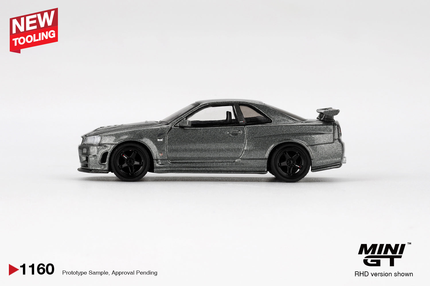 1:64 Mini GT Nissan Skyline GT-R (R34) Nismo CRS 1999 – Dark Metal Gray JDM die-cast model. Side