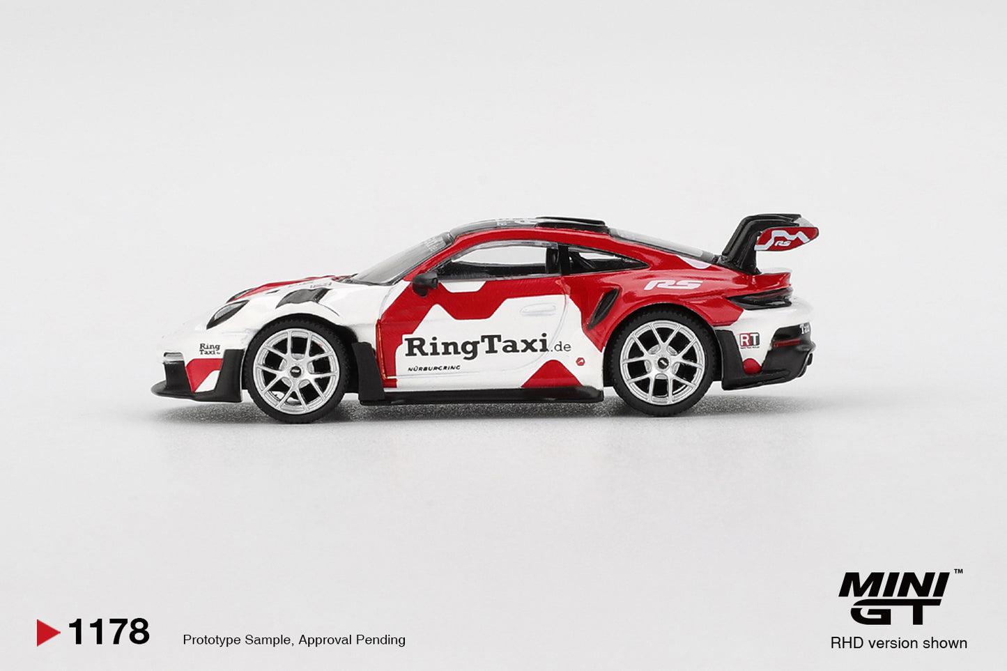 Mini GT 1:64 Porsche 911 (992) GT3 RS Weissach Ring Taxi 2025 track-focused model. Side