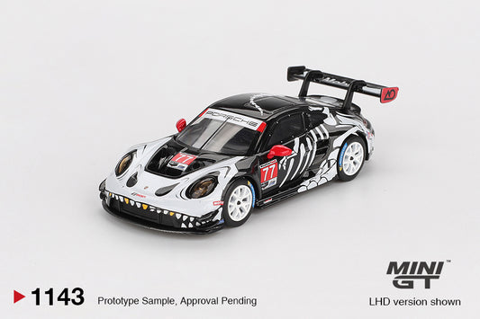 Mini GT Porsche 911 (992) GT3 R #77 AO Racing “Skeleton Rexy” livery, 1:64 scale detailed die-cast model. Front