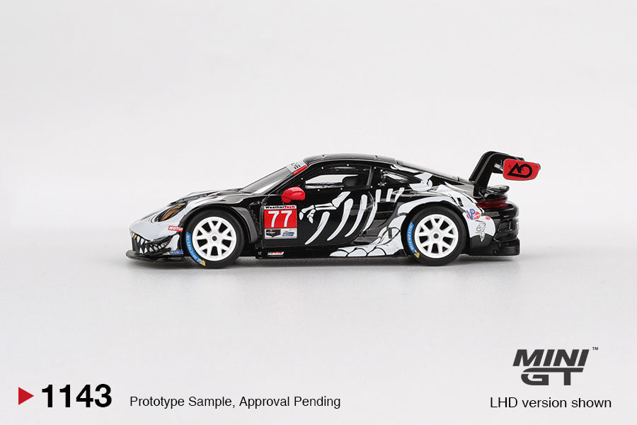 Mini GT Porsche 911 (992) GT3 R #77 AO Racing “Skeleton Rexy” livery, 1:64 scale detailed die-cast model. Side