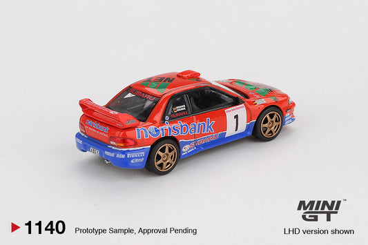 Mini GT 1:64 Subaru Impreza WRC97 #1 DRM Champion 1999 diecast model car in blue and gold livery. Back