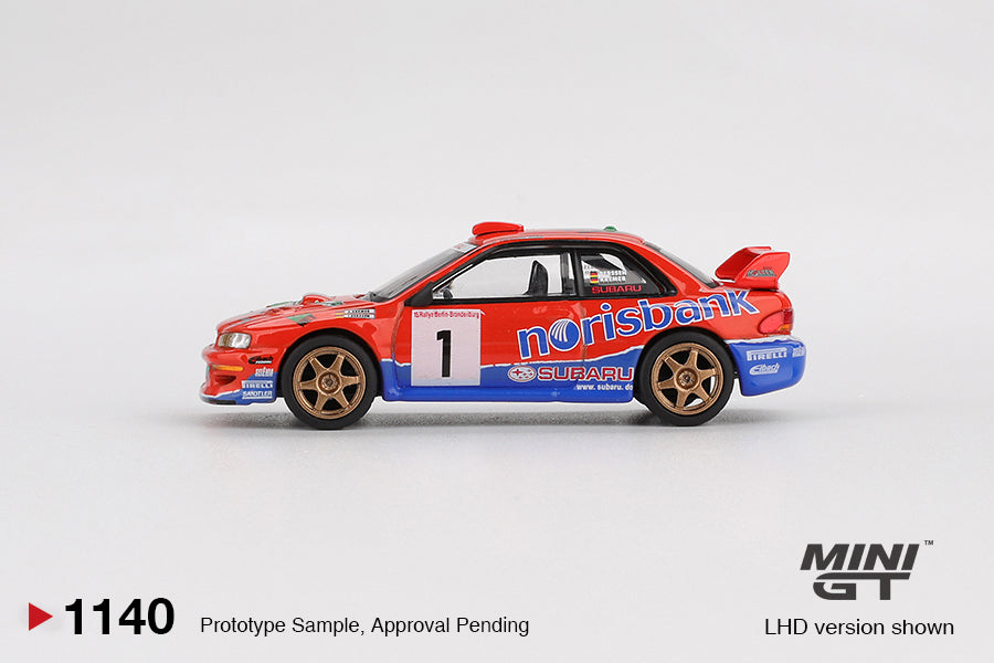 Mini GT 1:64 Subaru Impreza WRC97 #1 DRM Champion 1999 diecast model car in blue and gold livery. Side