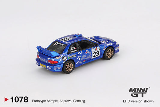 Mini GT Subaru Impreza WRC99 #23 from Acropolis Rally 2000 in blue rally livery with white graphics. Back