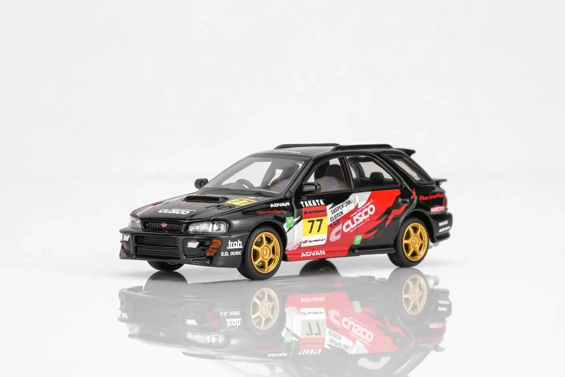 MotorHelix Subaru Impreza WRX STi Ver VI Wagon in CUSCO black livery with opening hood.