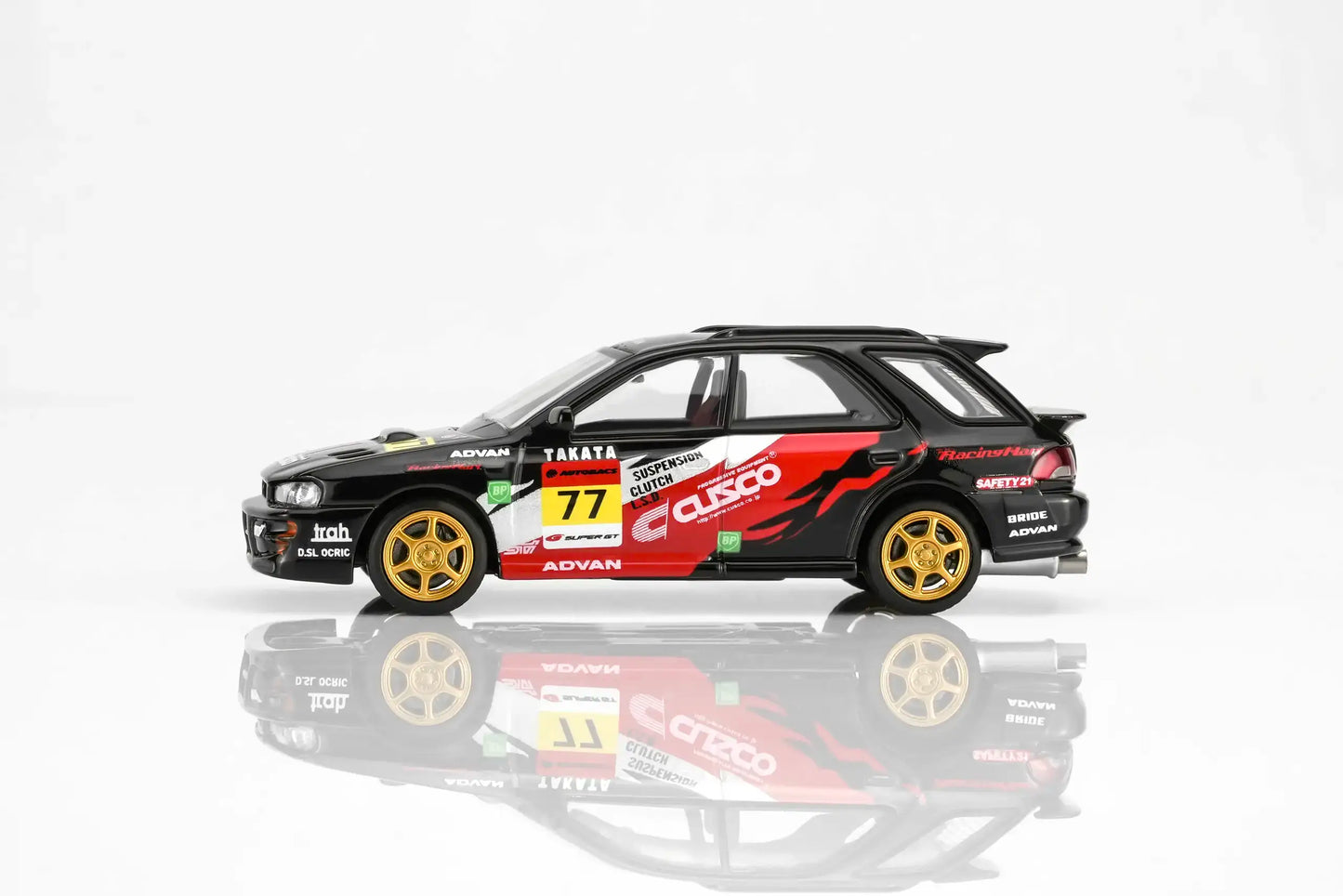 MotorHelix Subaru Impreza WRX STi Ver VI Wagon in CUSCO black livery with opening hood.