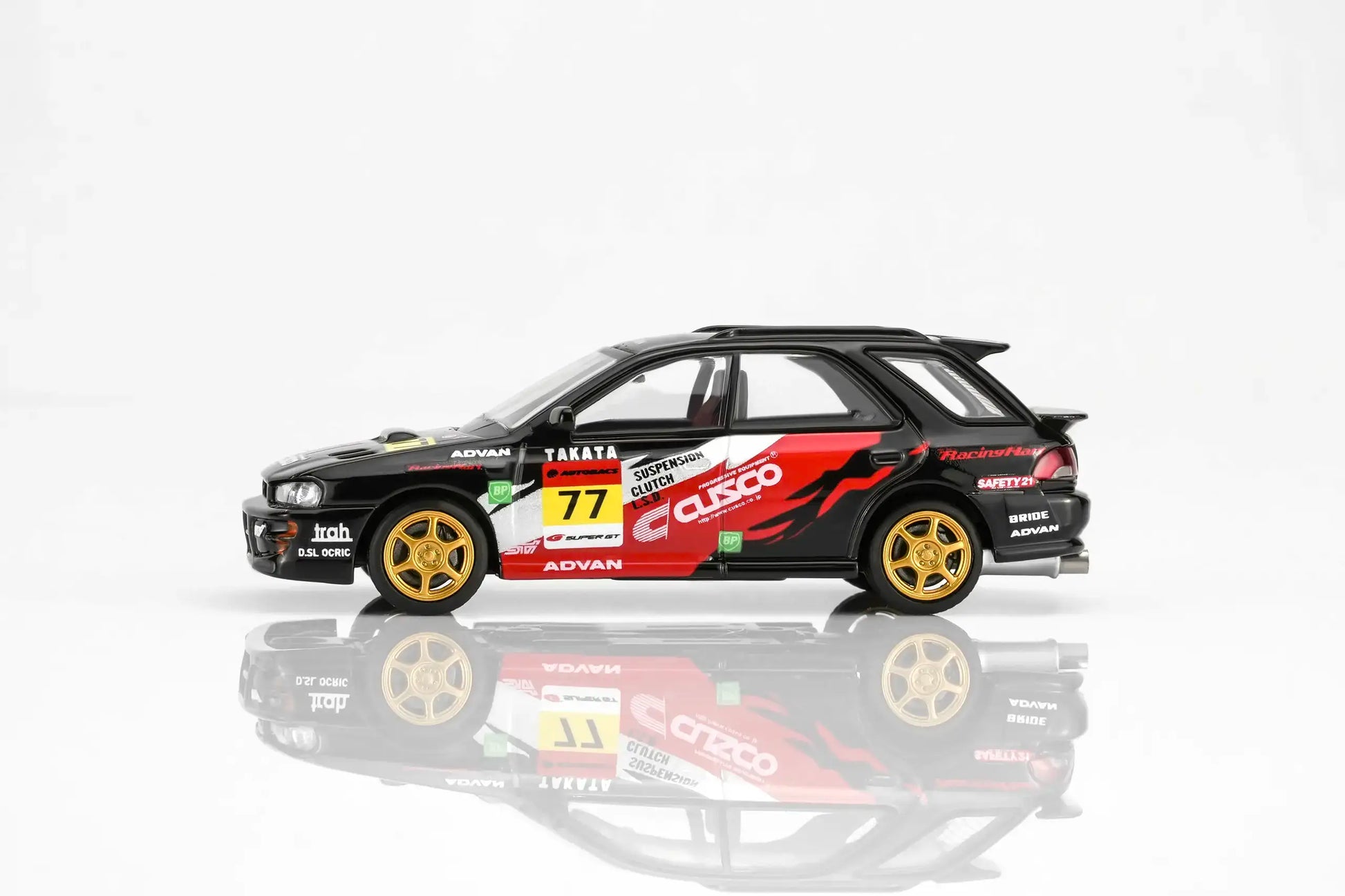 MotorHelix Subaru Impreza WRX STi Ver VI Wagon in CUSCO black livery with opening hood.
