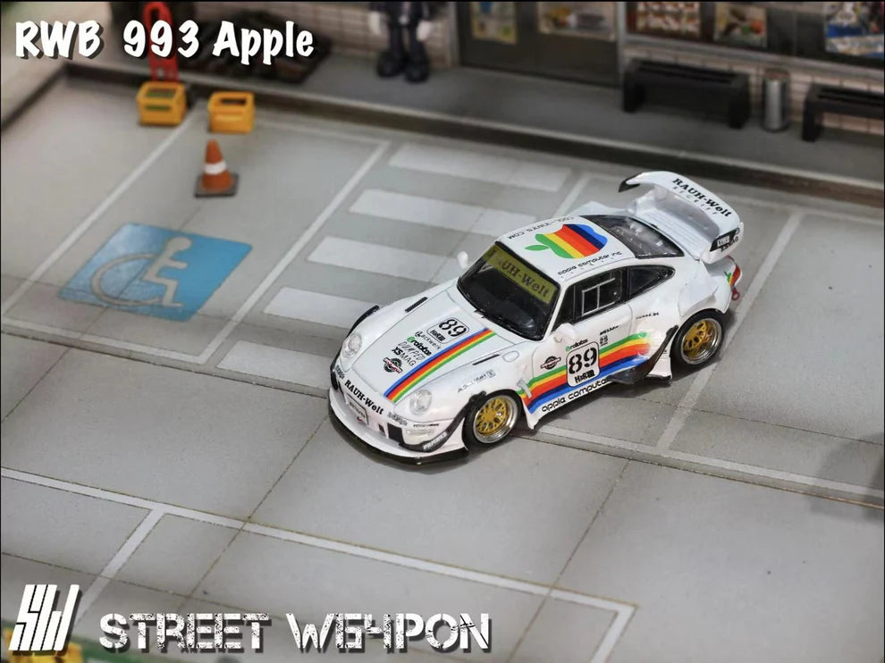 Street Weapon RWB 993 diecast in Apple Computer rainbow-striped livery, featuring widebody fenders, large rear wing, and detailed Porsche 993 design in 1:64 scale. Top