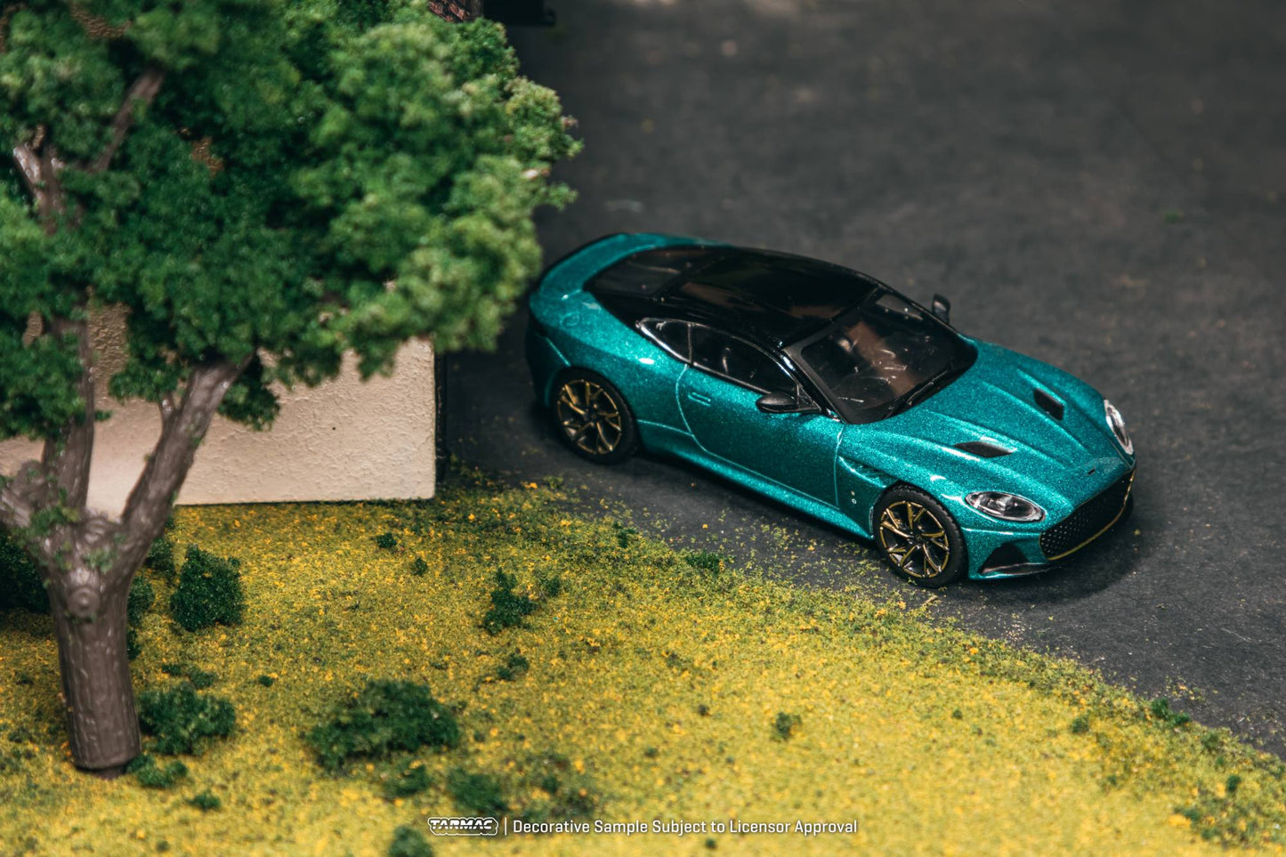 Tarmac Works 1:64 Aston Martin DBS Superleggera green metallic bronze accents diecast model. Top